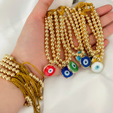 6mm gold bead bracelet with glass evil eye charm