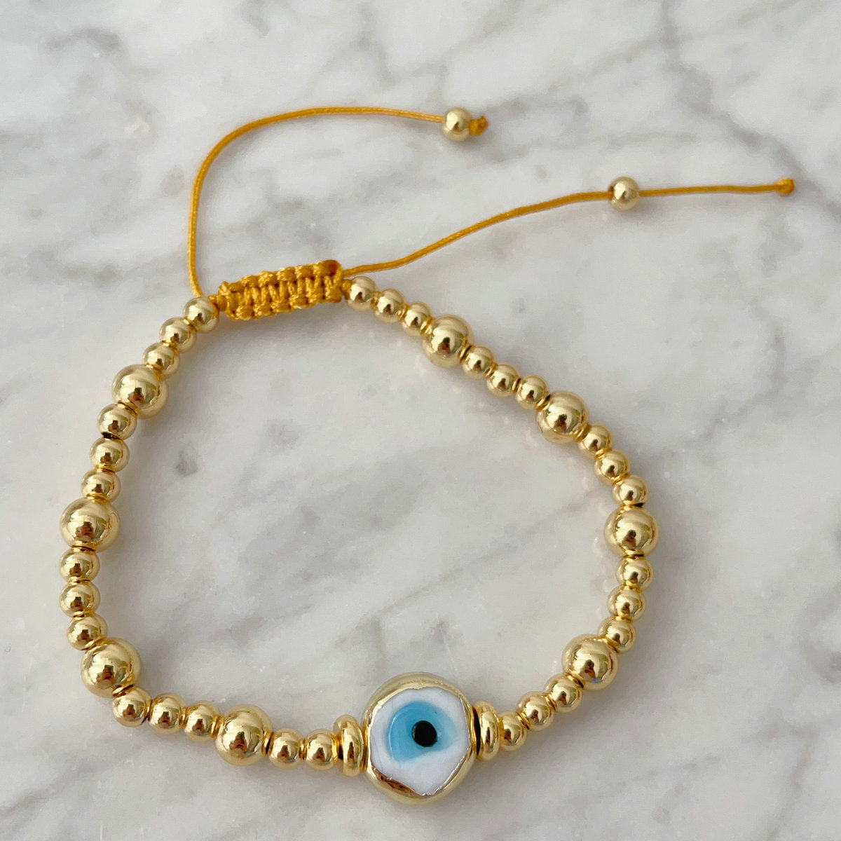 Gold ball with glass evil eye bracelet