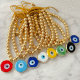 6mm gold bead bracelet with glass evil eye charm