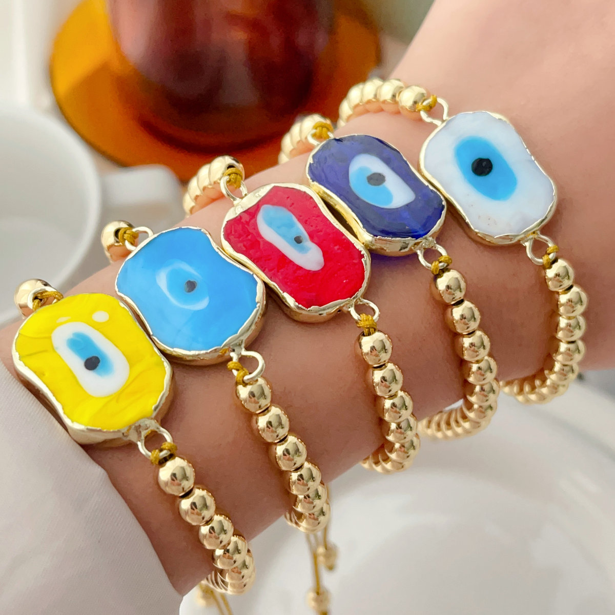 6mm gold bead bracelet with square glass evil eye charm