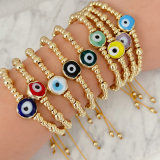 Gold ball with glass evil eye bracelet