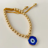 6mm gold bead bracelet with glass evil eye charm