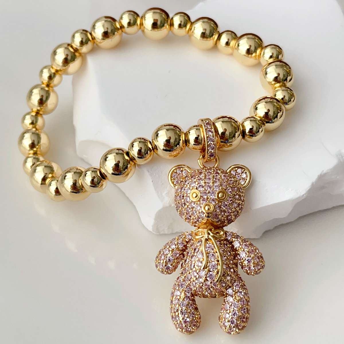 Gold bead bracelet with big cz bear in pink