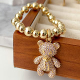 Gold bead bracelet with big cz bear in pink
