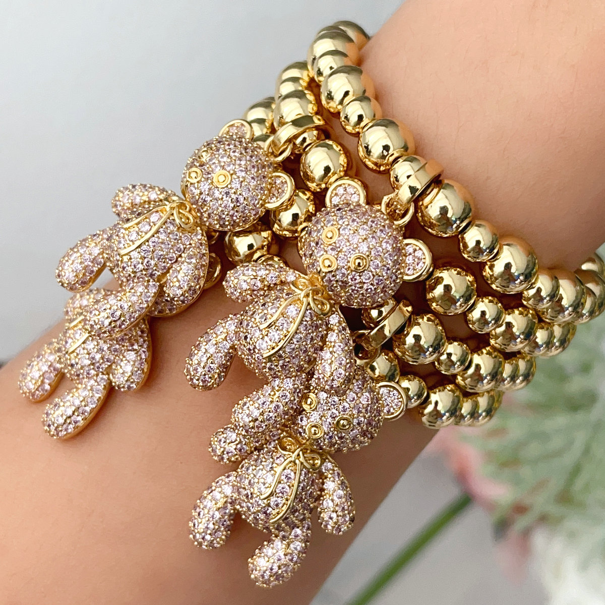 Gold bead bracelet with big cz bear in pink