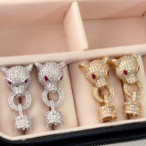Pave leopard head earrings