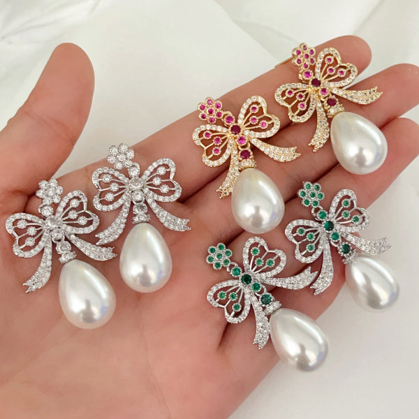 Glass pearl bow earrings