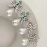 Glass pearl bow earrings