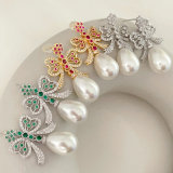 Glass pearl bow earrings
