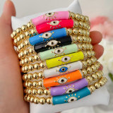 Evil eye elastic gold ball bracelet
