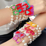 Pearl thread bracelet with square miyuki charm