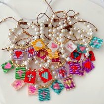Pearl thread bracelet with square miyuki charm