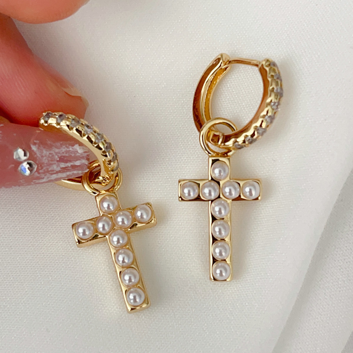 Pearl cross charm earrings