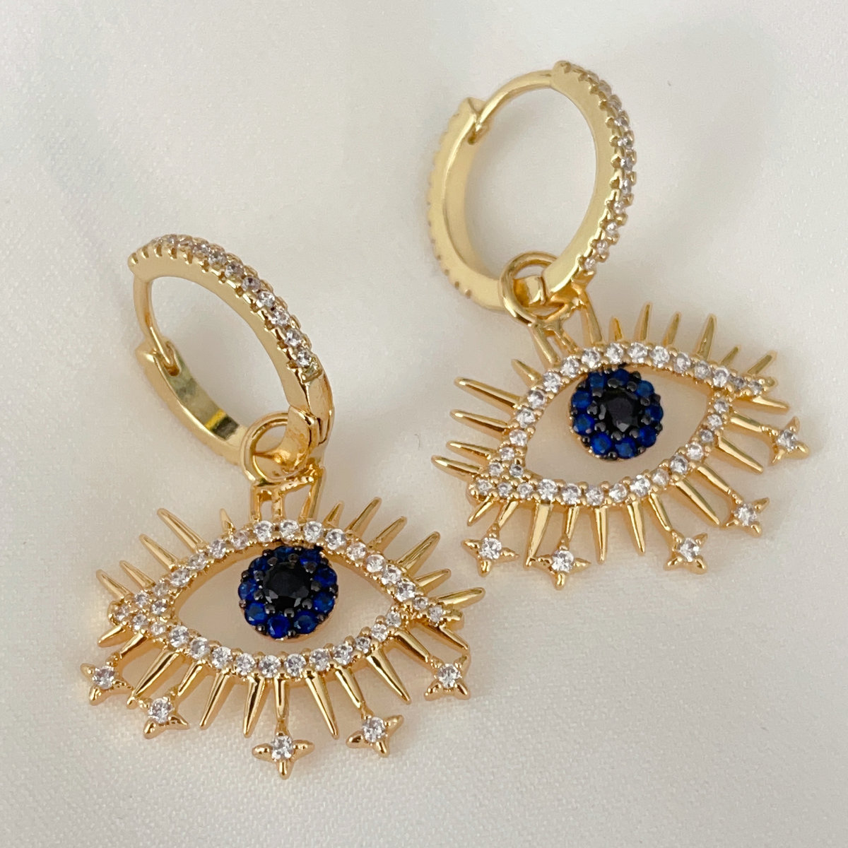 Pave cz blue eye drop earrings
