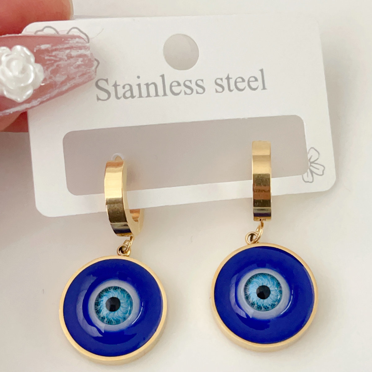 Stainless steel eye charm earrings