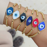 Glass evil eye gold bead bracelet