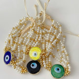 Glass pearl evil eye bracelet