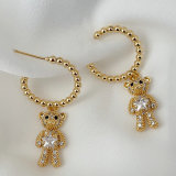 Gold bead hoops with bear pendant