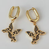 Black dinosaur drop earrings