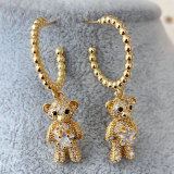 Gold bead hoops with bear pendant