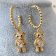 Gold bead hoops with bear pendant