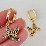 Black dinosaur drop earrings