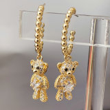 Gold bead hoops with bear pendant