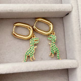 Green dinosaur drop earrings