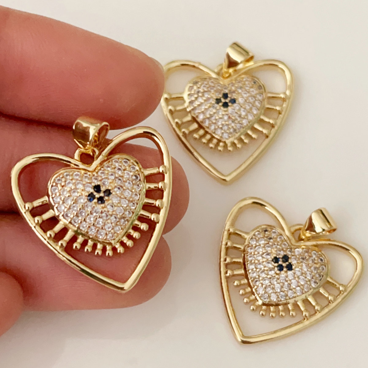 Pave heart eye pendant