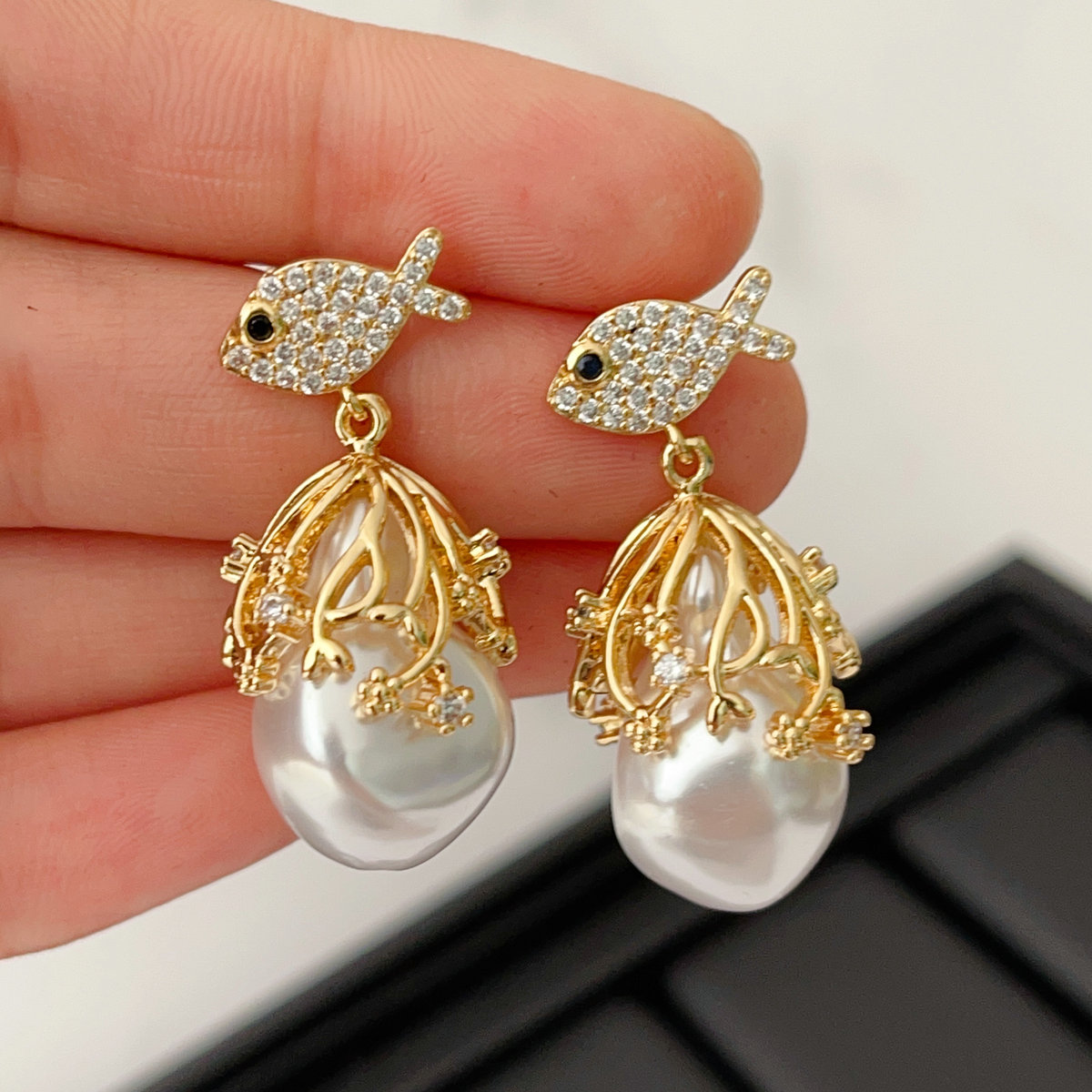 Pave fish earring with glass pearl pendant