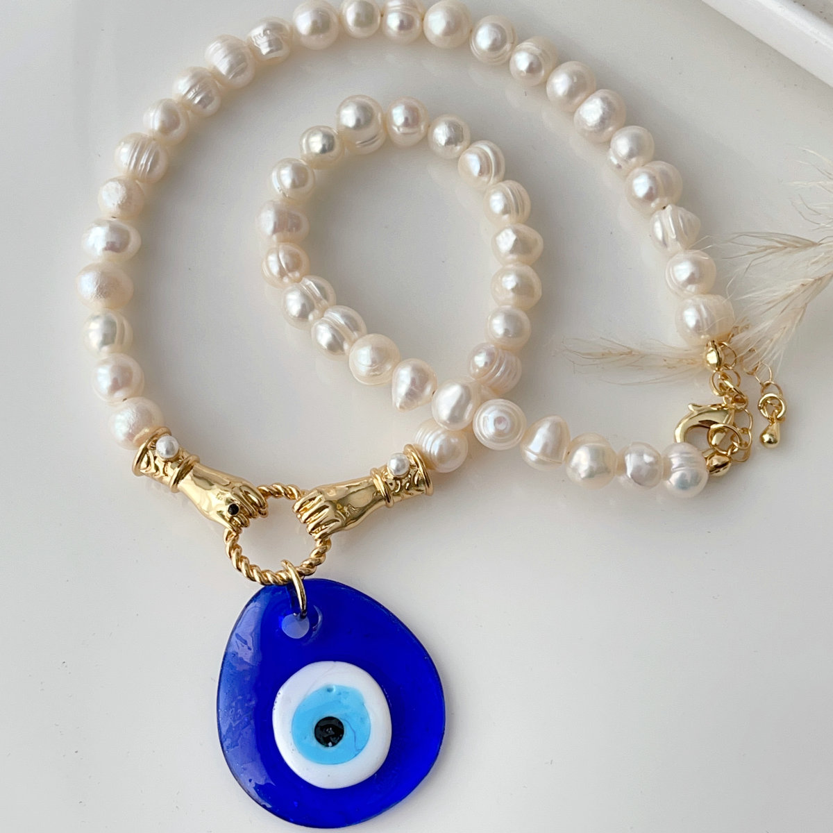 Fresh water pearl necklace with big glass eye pendant