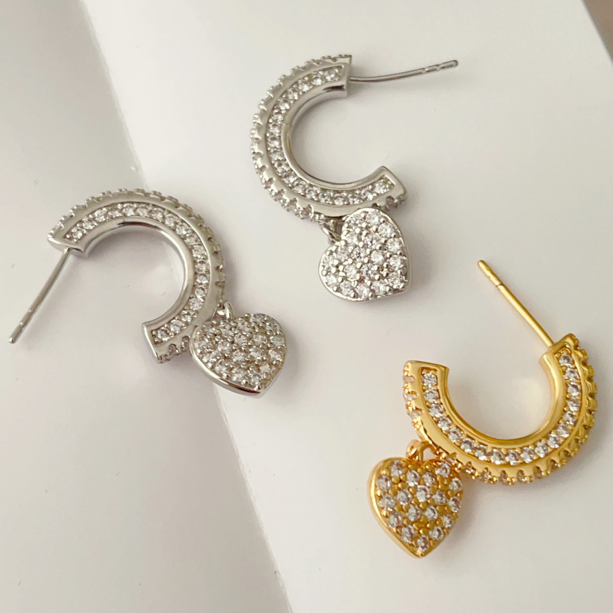 Pave half hoop earring with heart charm