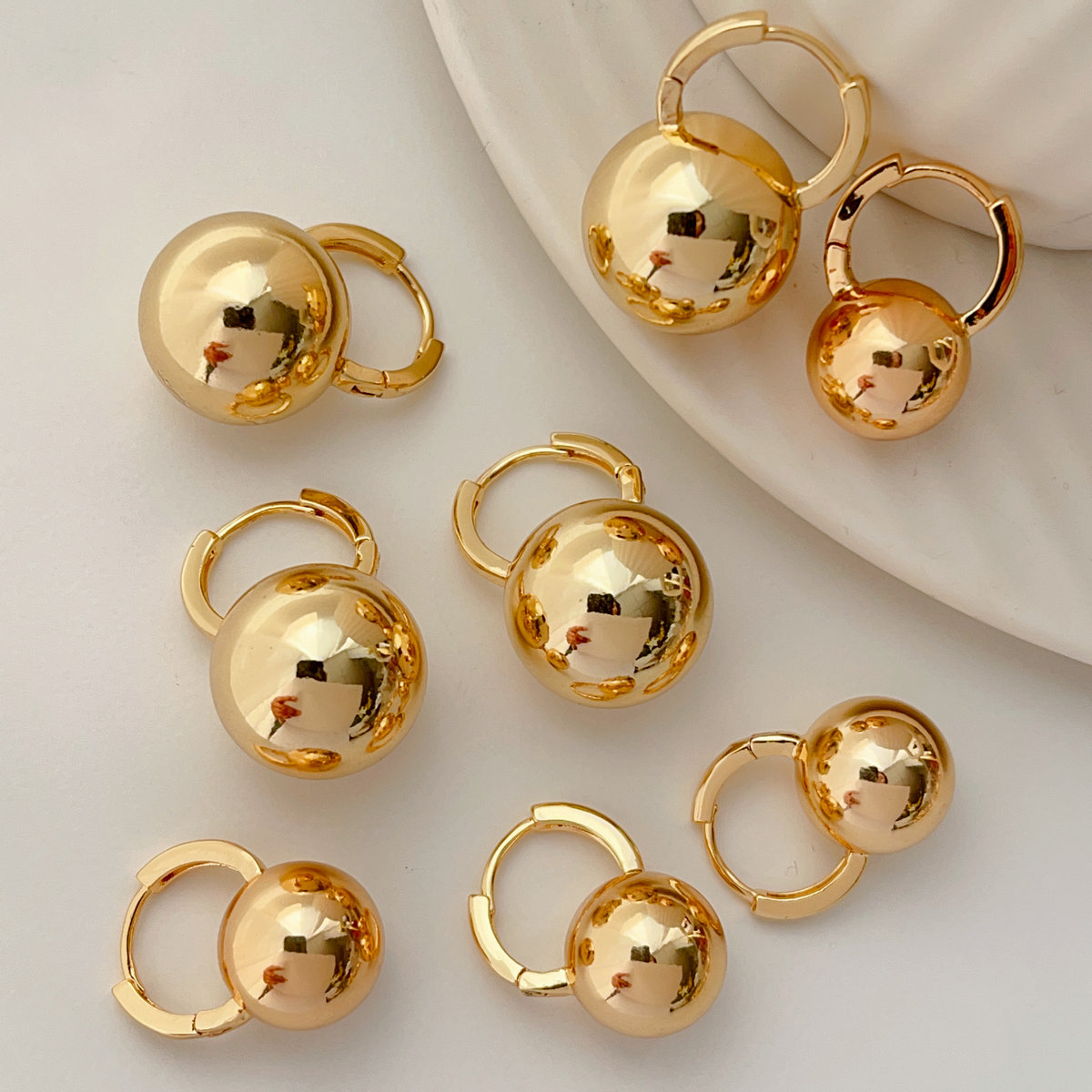 Gold ball drop earrings