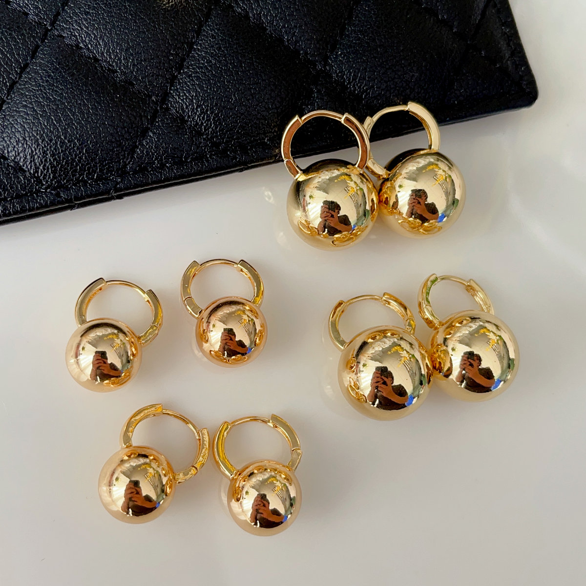 Gold ball drop earrings