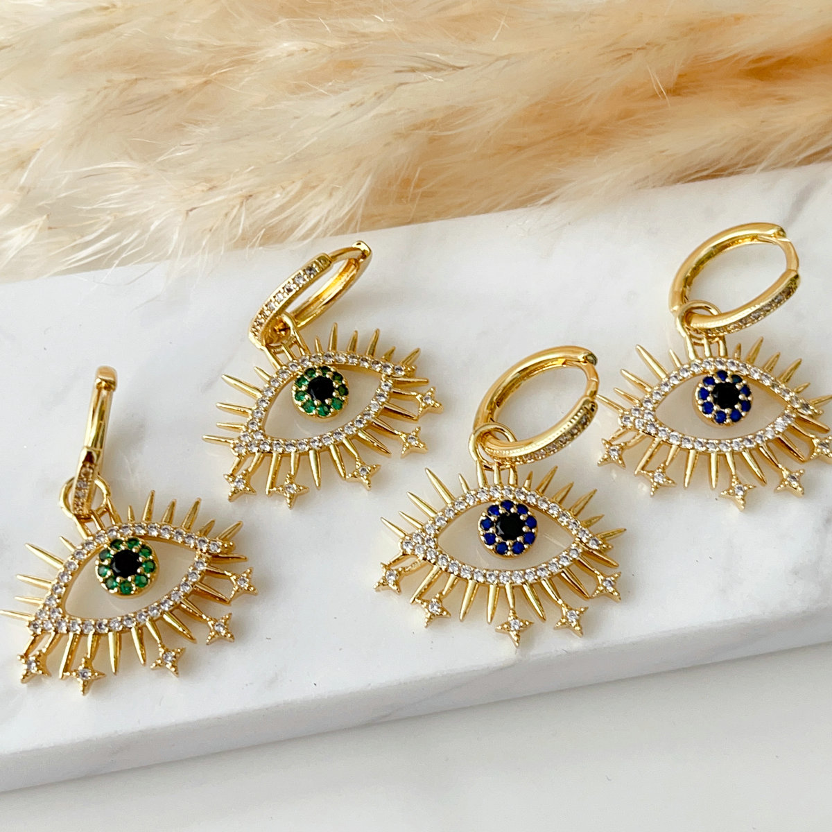 Pave zircon eye pendant earrings