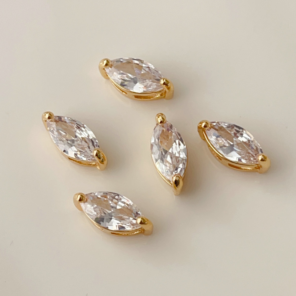 White zircon eye charm