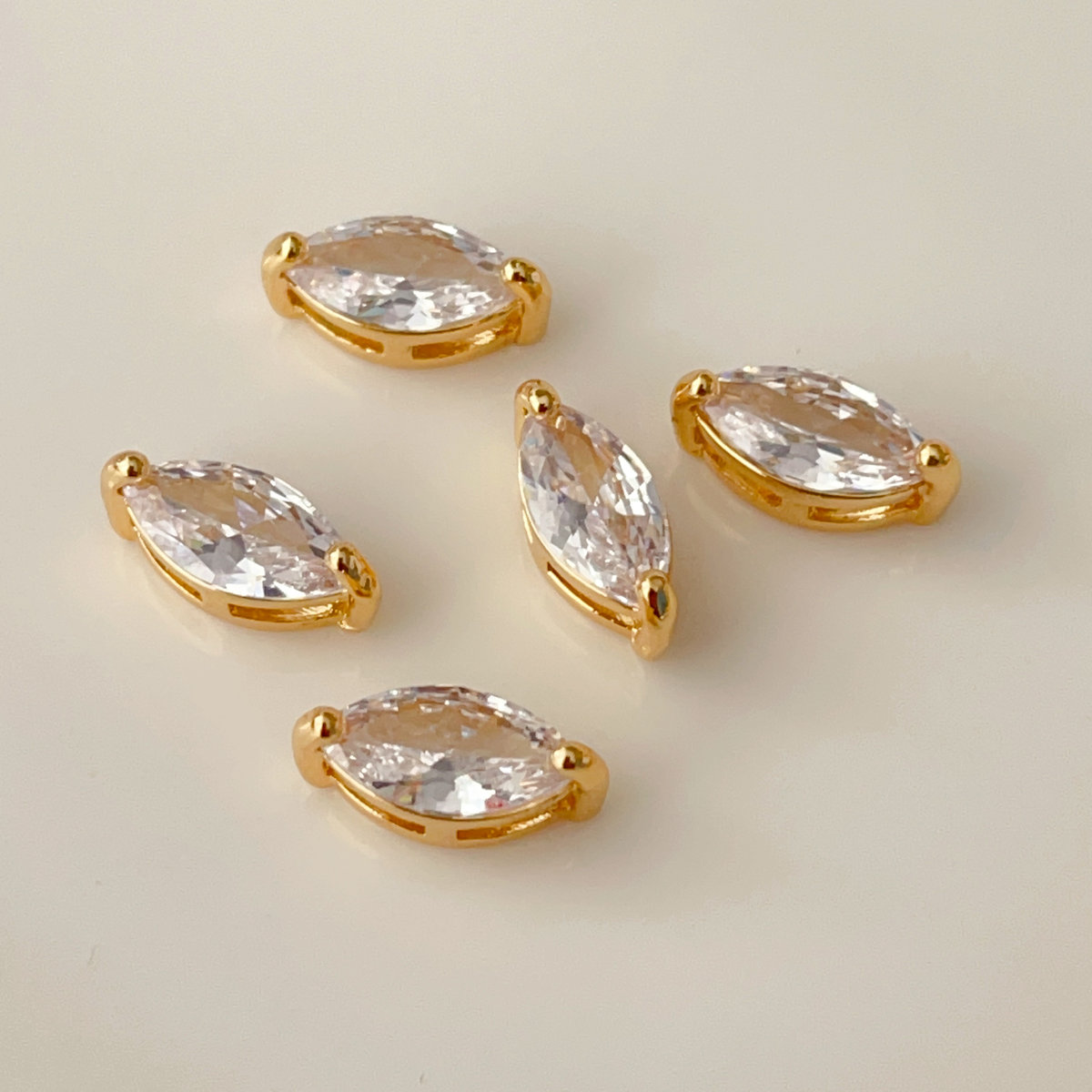 White zircon eye charm