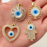 Pave shell evil eye hand shape pendant