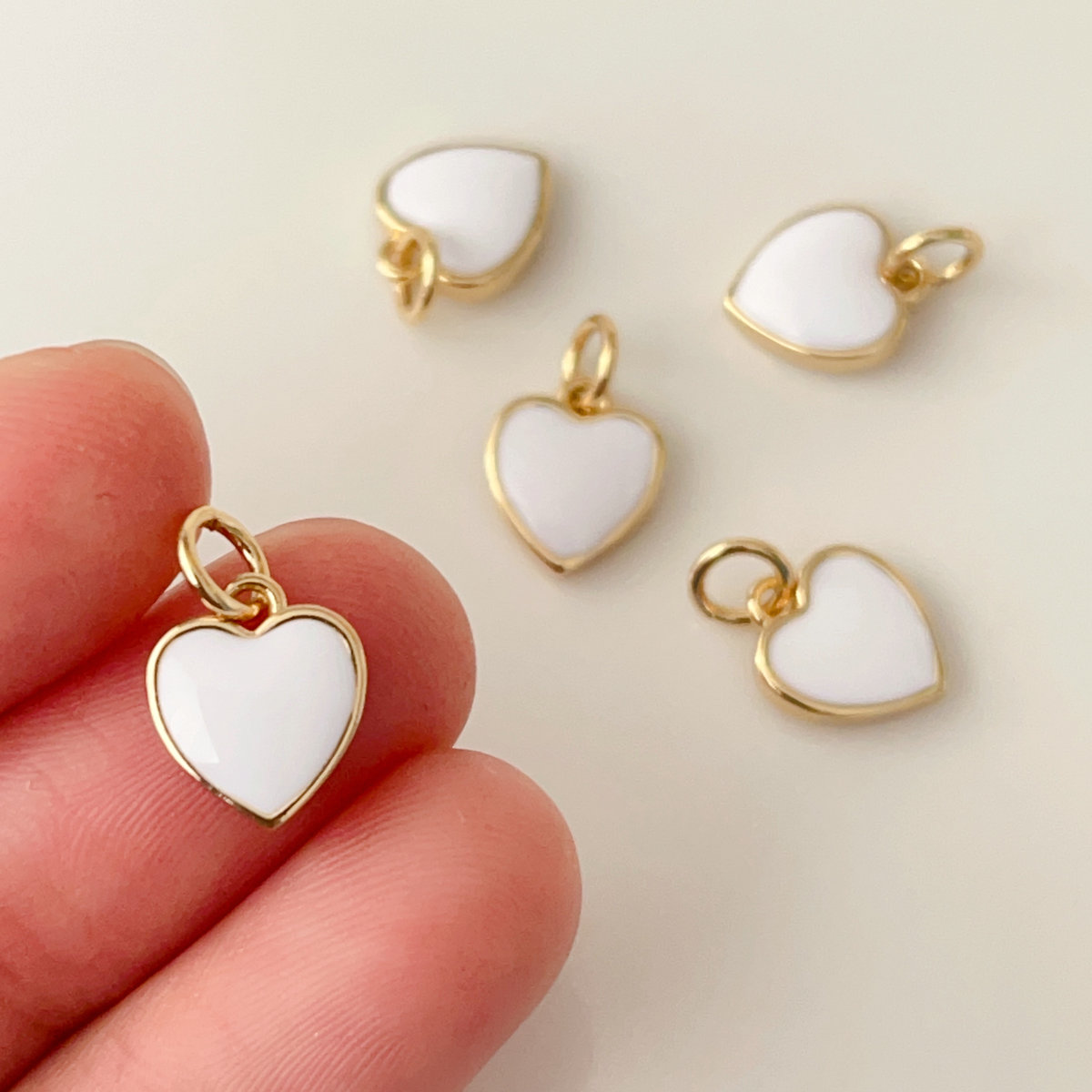 Small white enamel heart charm