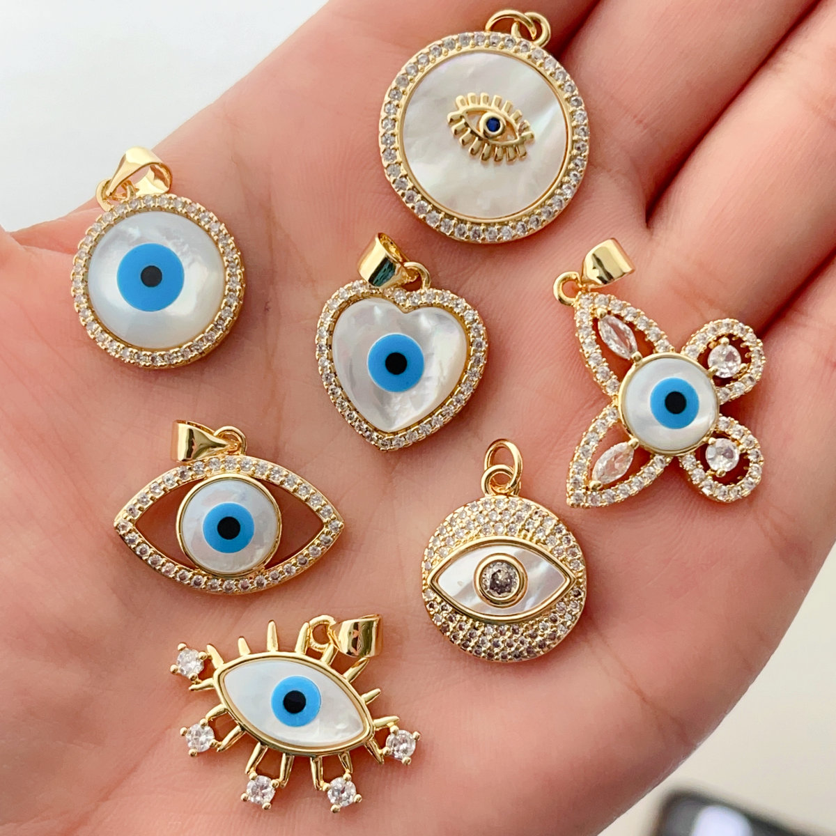 Pave shell evil eye pendant