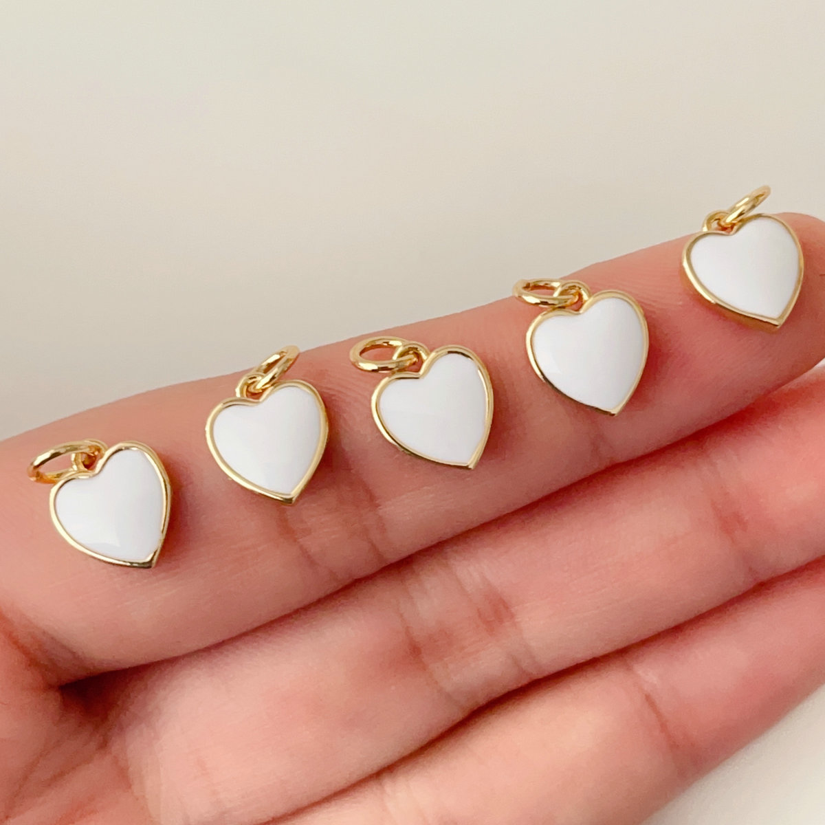 Small white enamel heart charm