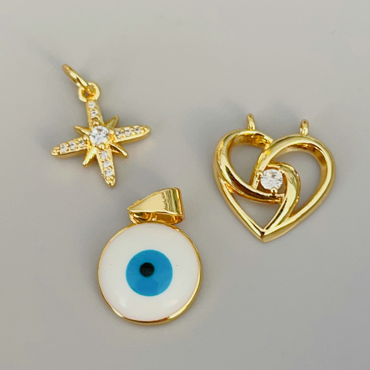 Pave small eye , star.. charm