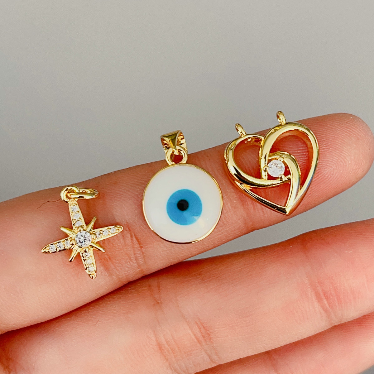 Pave small eye , star.. charm