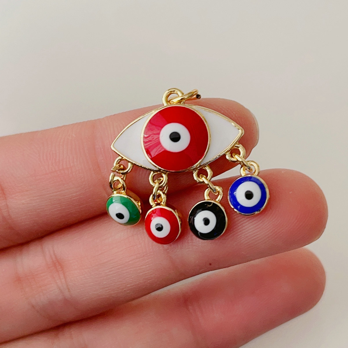 Enamel eye charm