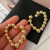 Gold ball heart earrings