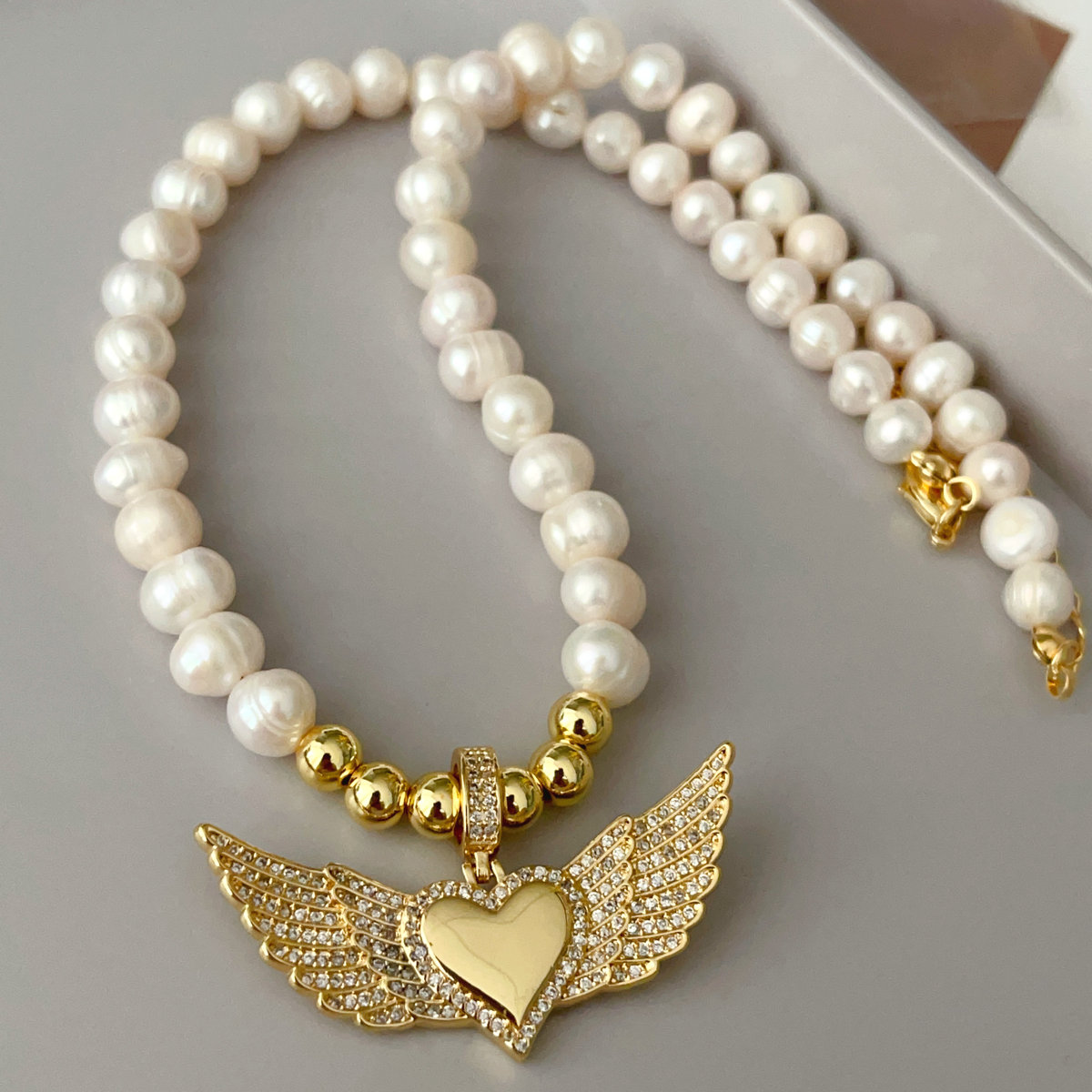 Angel's wings pendant pearl necklace