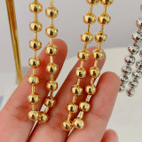 Gold bead ball long earrings