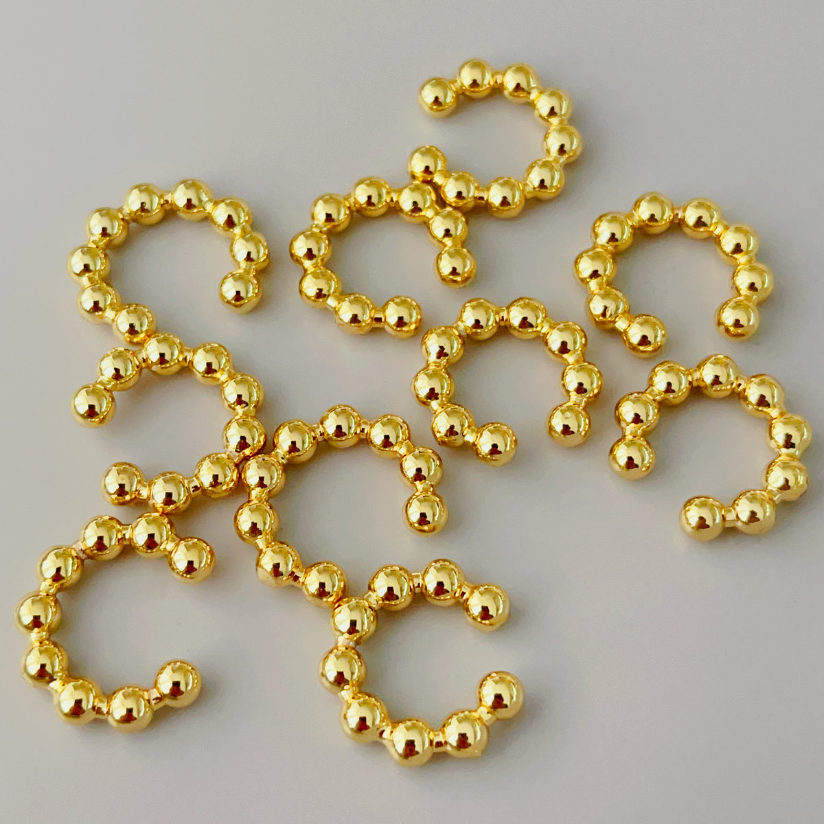 Gold ball ear cuff
