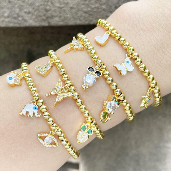 Gold bead elstic bracelets with mix charm
