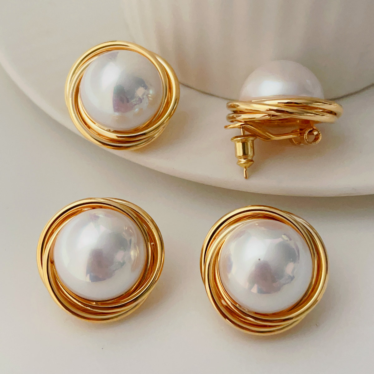 Big gold twist earrings